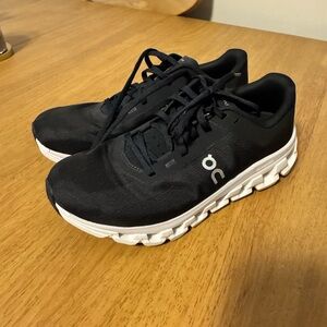 On Running Black Athletic Shoes with White Soles